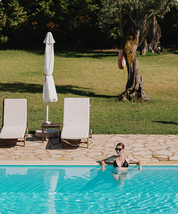 Woman relaxing in her private villa pool with Beach Please Tulum Woman relaxing in her private villa pool with Beach Please Tulum